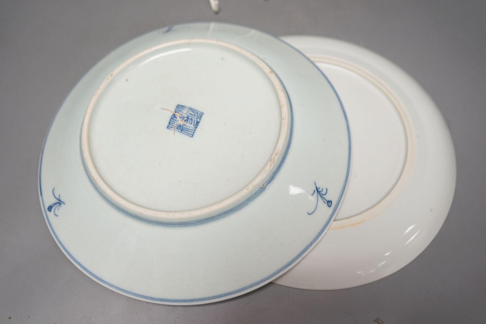 An 18th century Chinese blue and white bottle vase and two 19th century blue and white plates, diameter of largest plate - 25cm